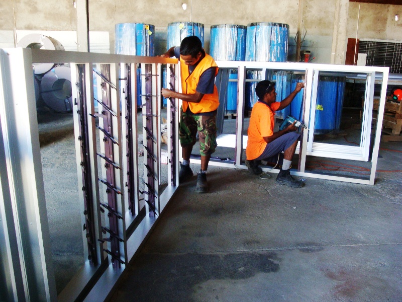 DBS II staff making window frames.