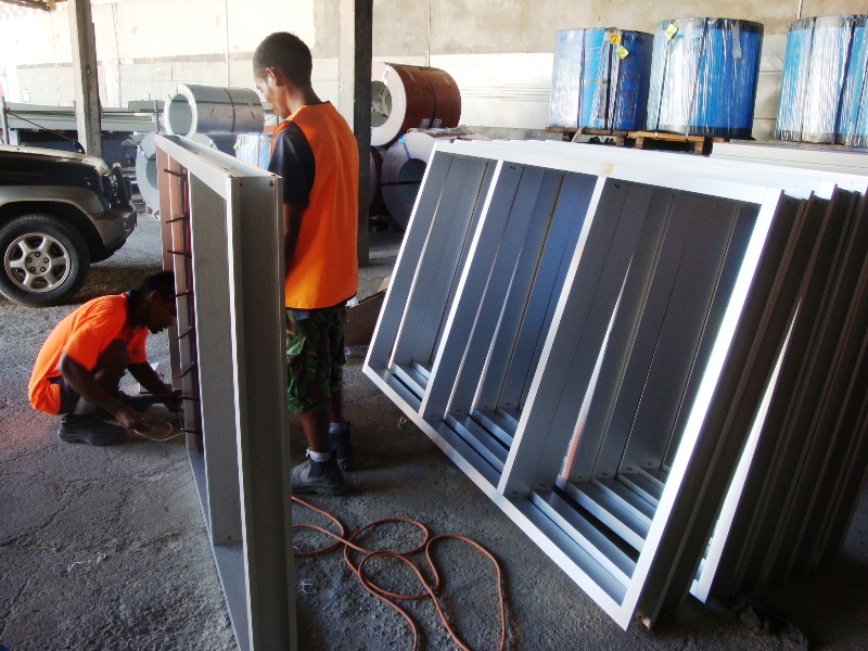 DBS II staff making window frames.